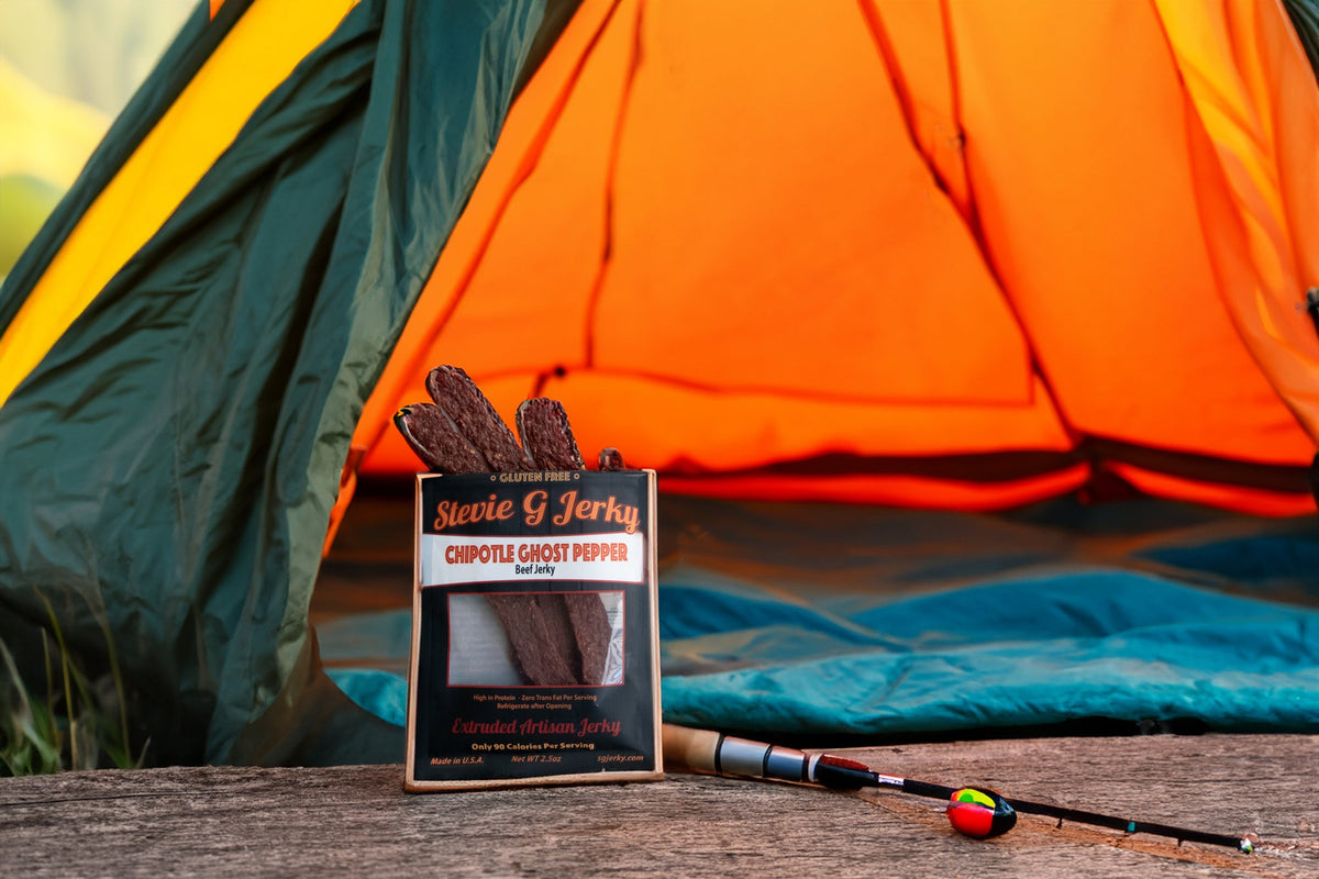 Stevie G beef jerky bags at a campsite tent, ready for the trail