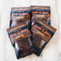 Four bags of Stevie G Honey BBQ beef jerky