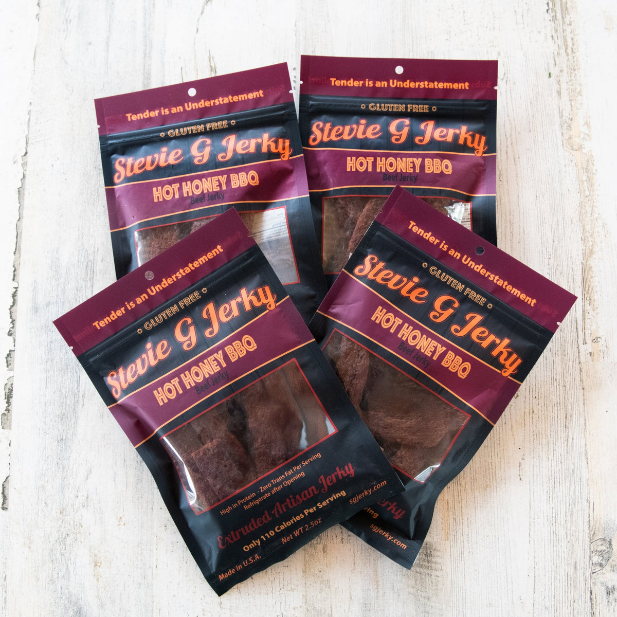Four bags of Stevie G Hot Honey BBQ beef jerky