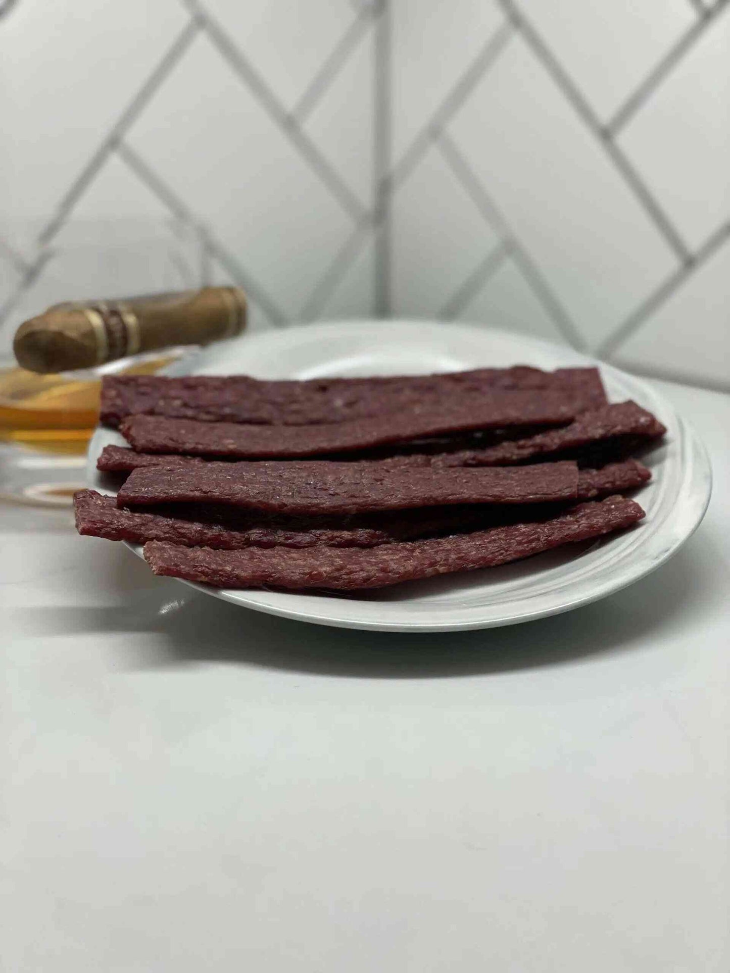 Tangy Teriyaki Beef Jerky Flats displayed on a plate