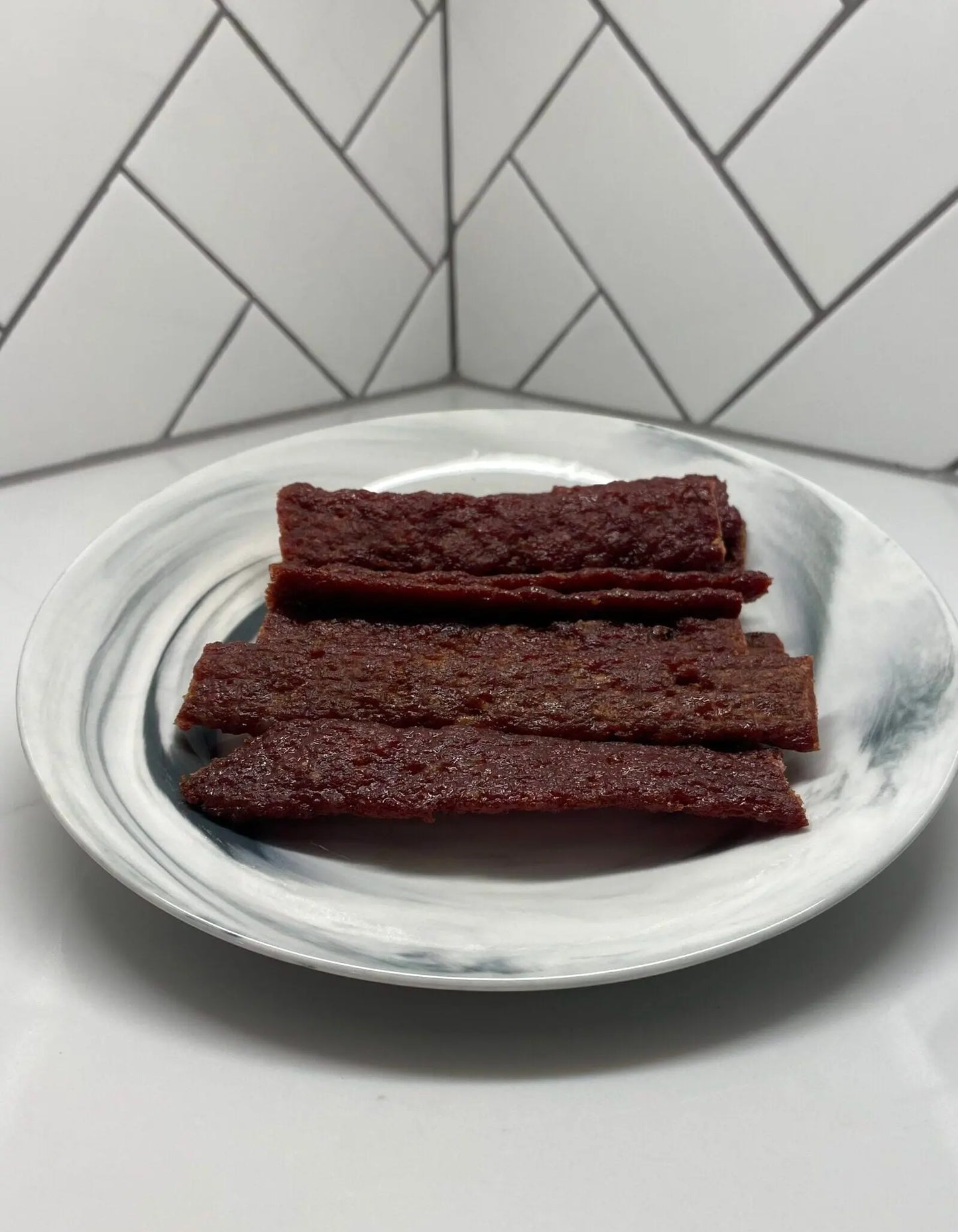 Hot-Honey BBQ Beef Jerky Flats on a white plate